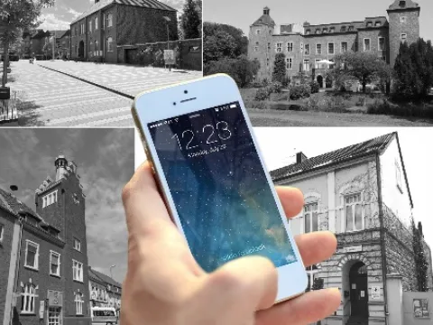 Smartphone vor Verwaltungsgebäuden